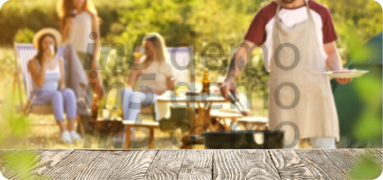 Empty wooden table at barbecue party outdoors